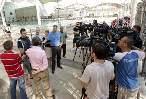 australian swim team captain grant hackett surrounded by the media in kl photo magic pbk sal.jpg